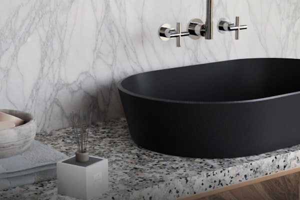 Elegant modern bathroom fixtures with matte black washbasin and chrome faucet